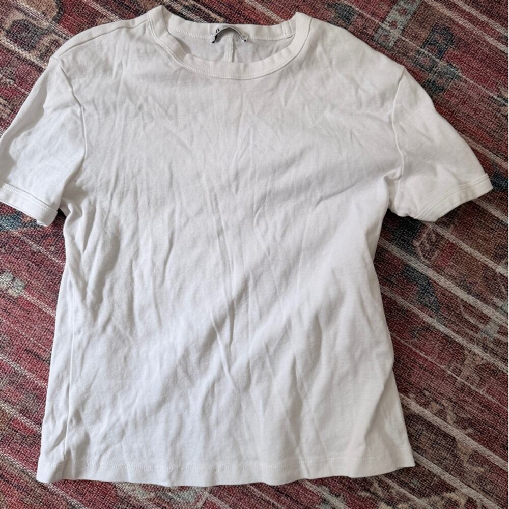 Plain white shirt size L but fits like M. Never worn